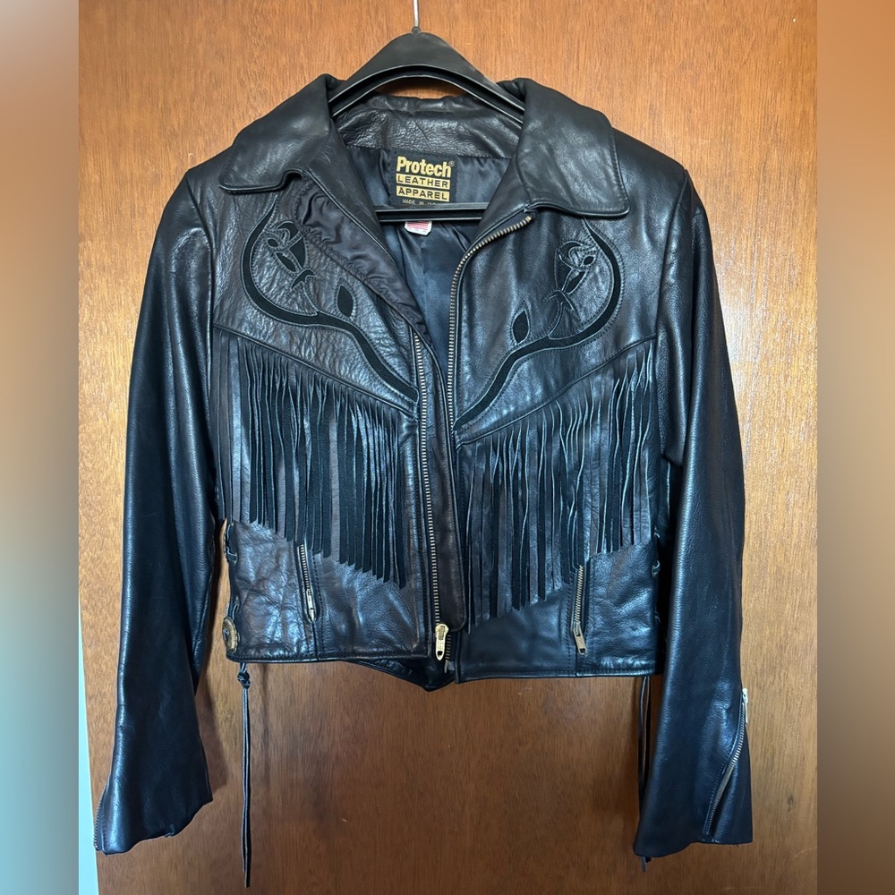 LEATHER FRINGE RIDING JACKET WITH SUEDE ROSE INLAY DESIGN. BLACK ON BLACK